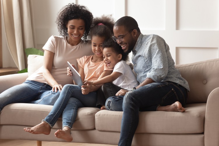 mom and dad reading to daughter